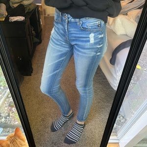 Distressed blue jeans